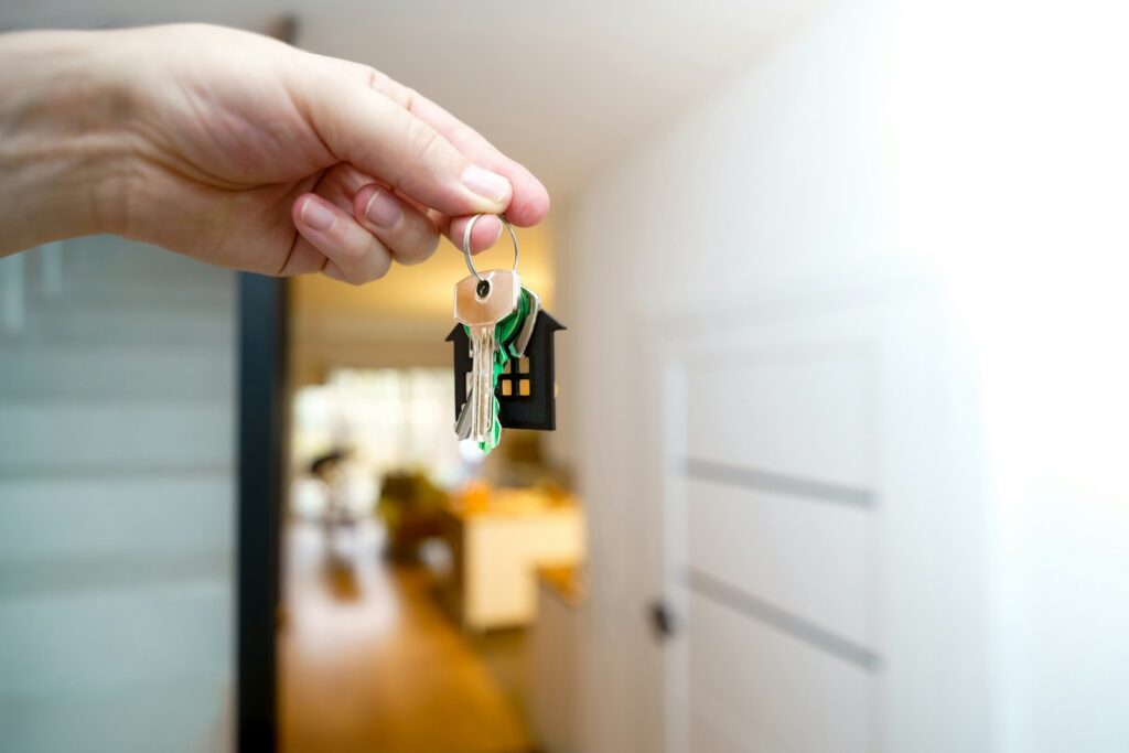 New tenant holding house keys at the front door