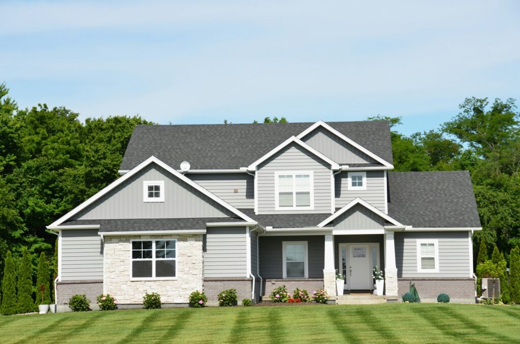 Modern grey home with a green lawn